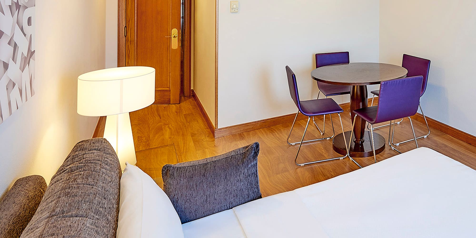 a room with a table and chairs