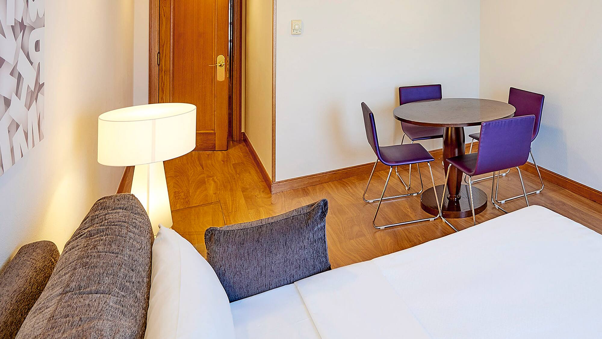 a room with a table and chairs