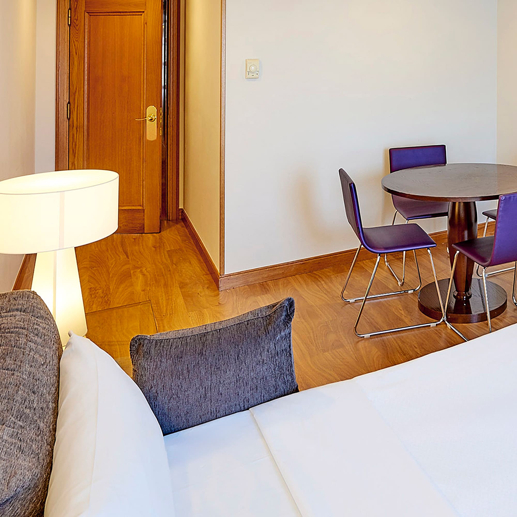 a room with a table and chairs