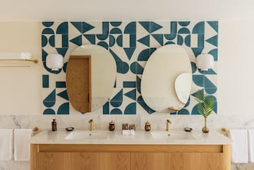 a bathroom with a mirror and a wall