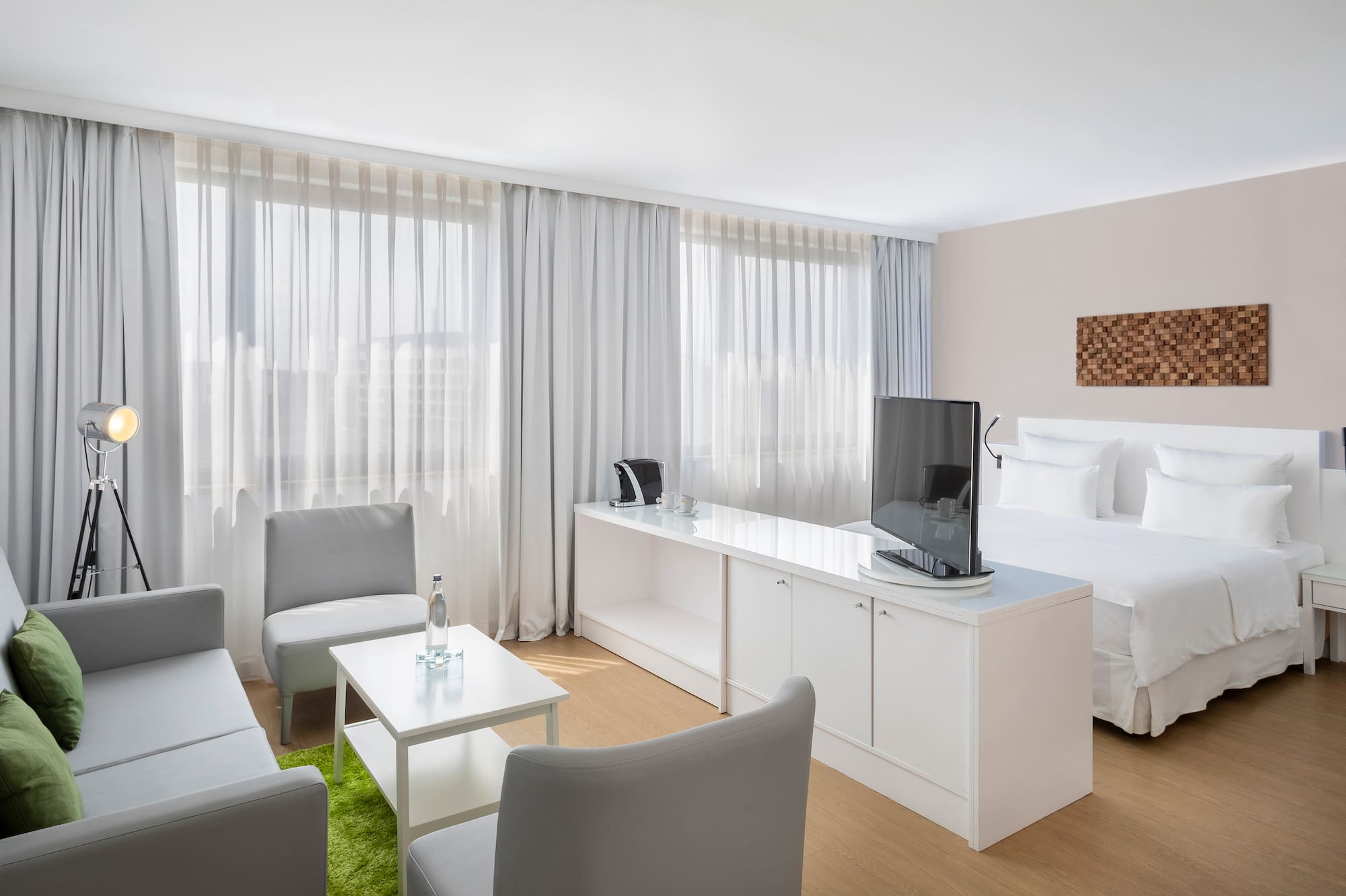 a room with a bed and a tv