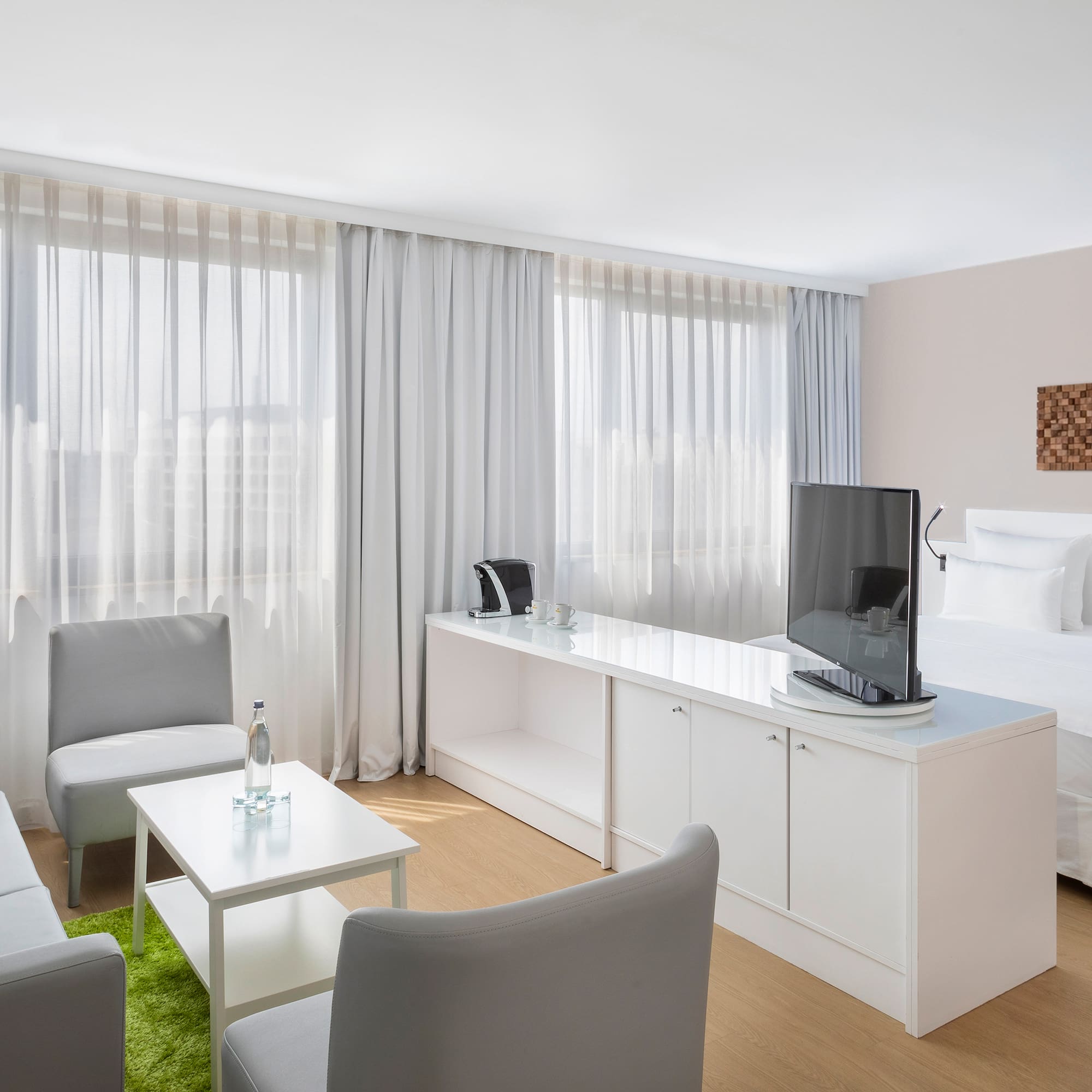 a room with a bed and a tv