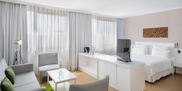 a room with a bed and a tv