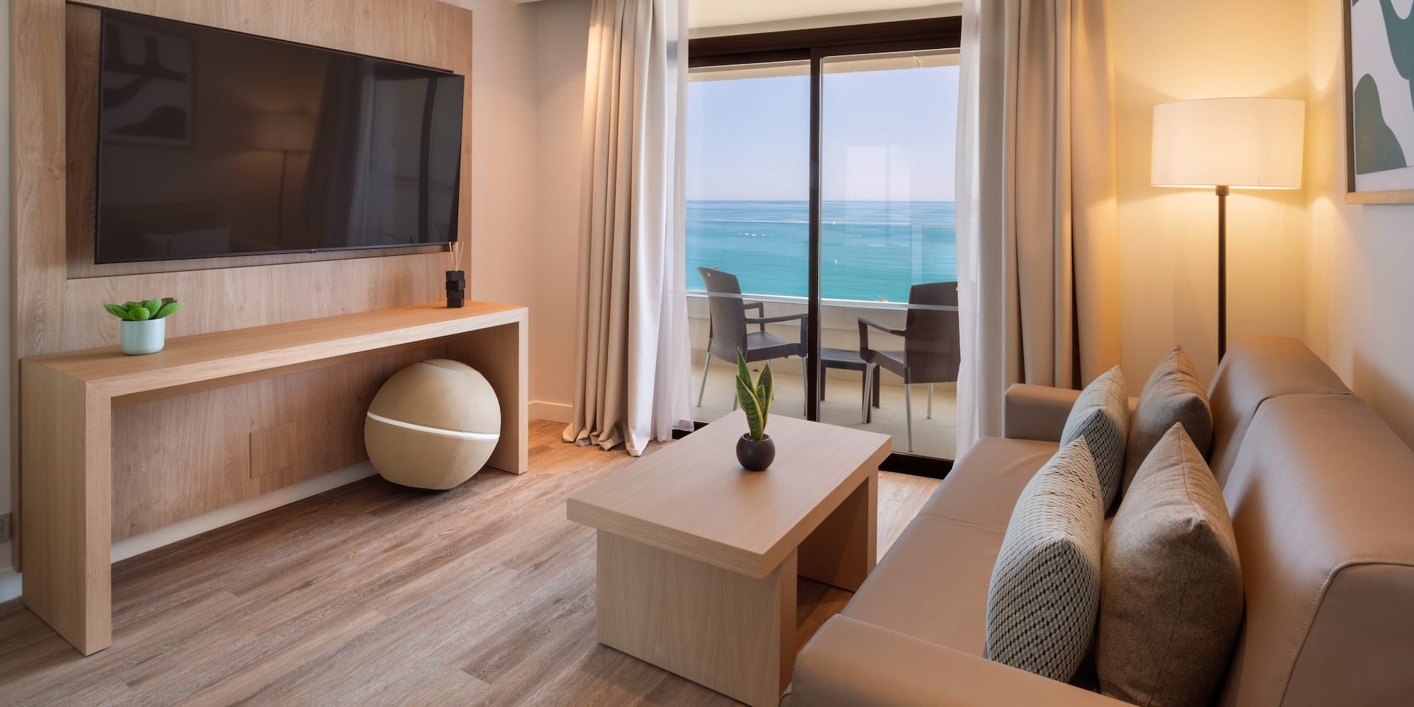 a living room with a television and a table