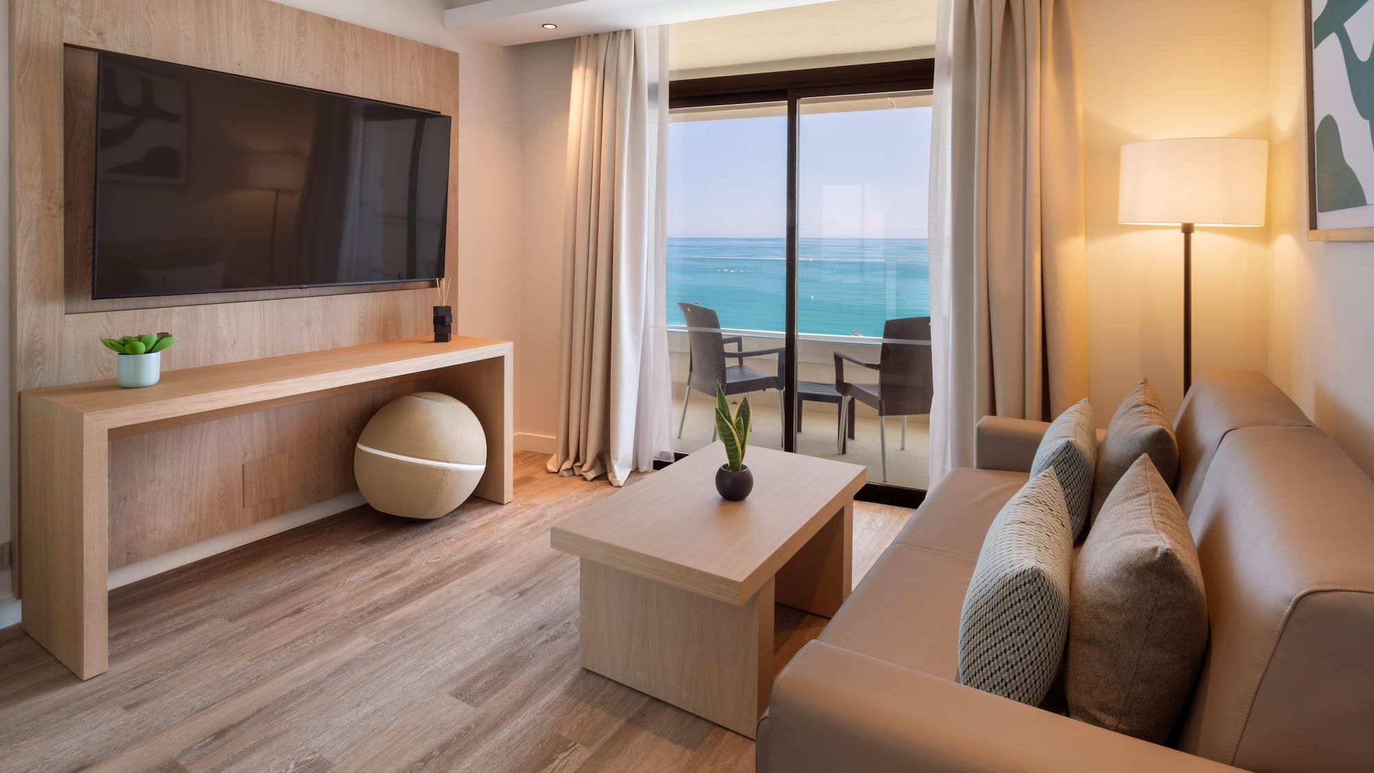 a living room with a television and a table