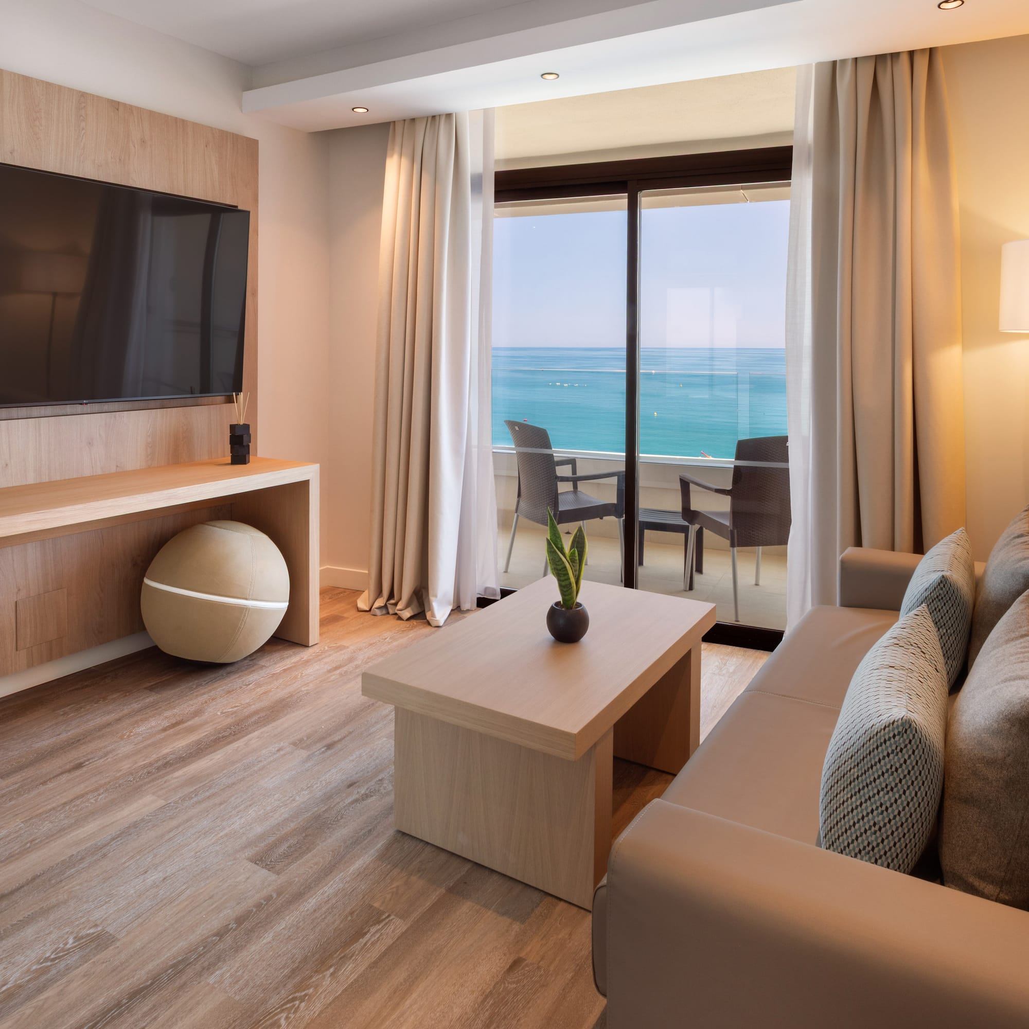 a living room with a television and a table