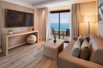 a living room with a television and a table