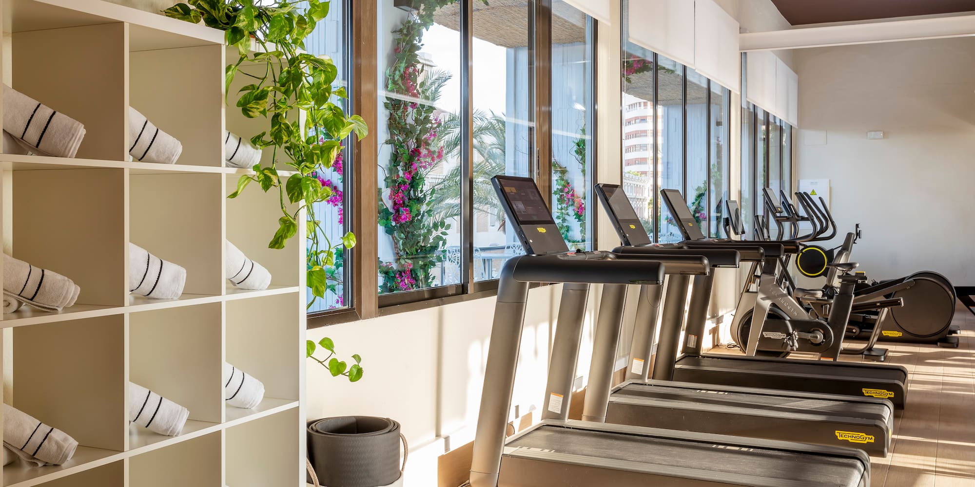 a room with treadmills and exercise bikes