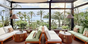 a patio with chairs and tables