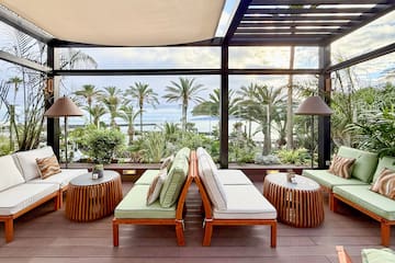 a patio with chairs and tables