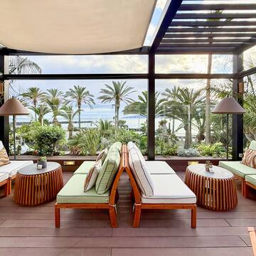 a patio with chairs and tables