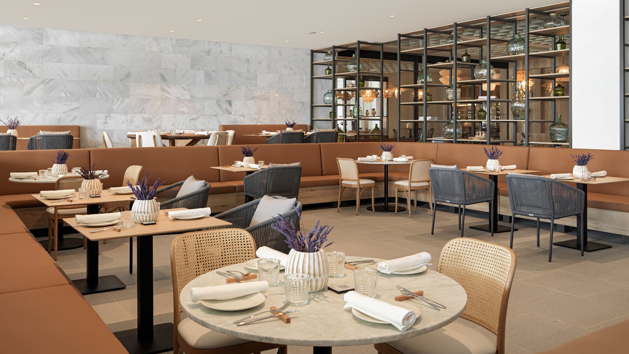 a restaurant with tables and chairs