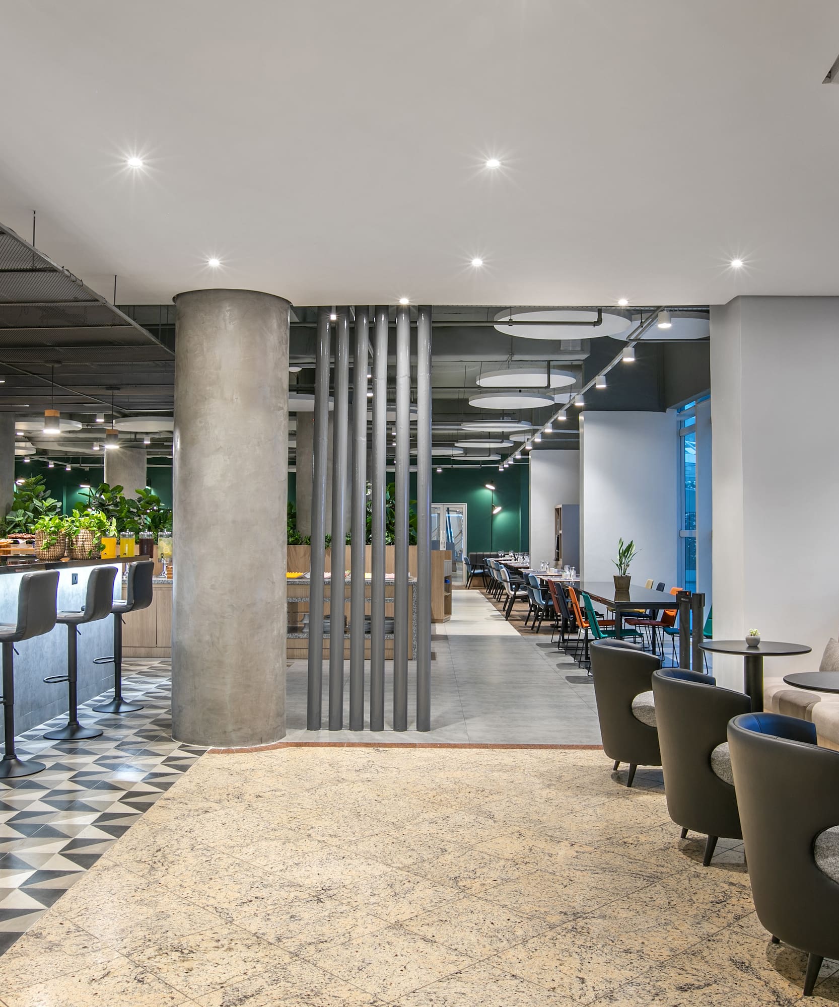 a room with a bar and chairs