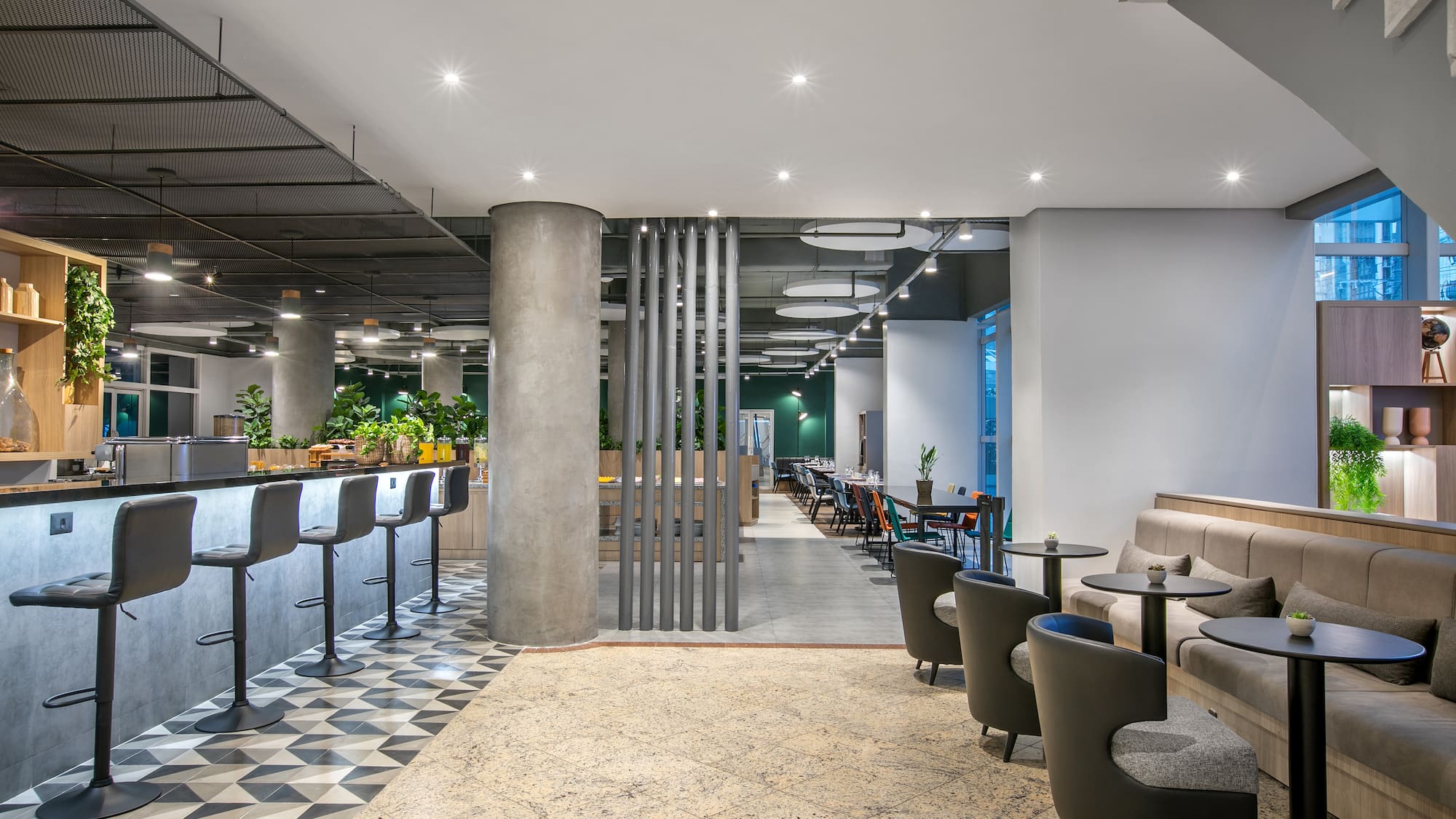 a room with a bar and chairs