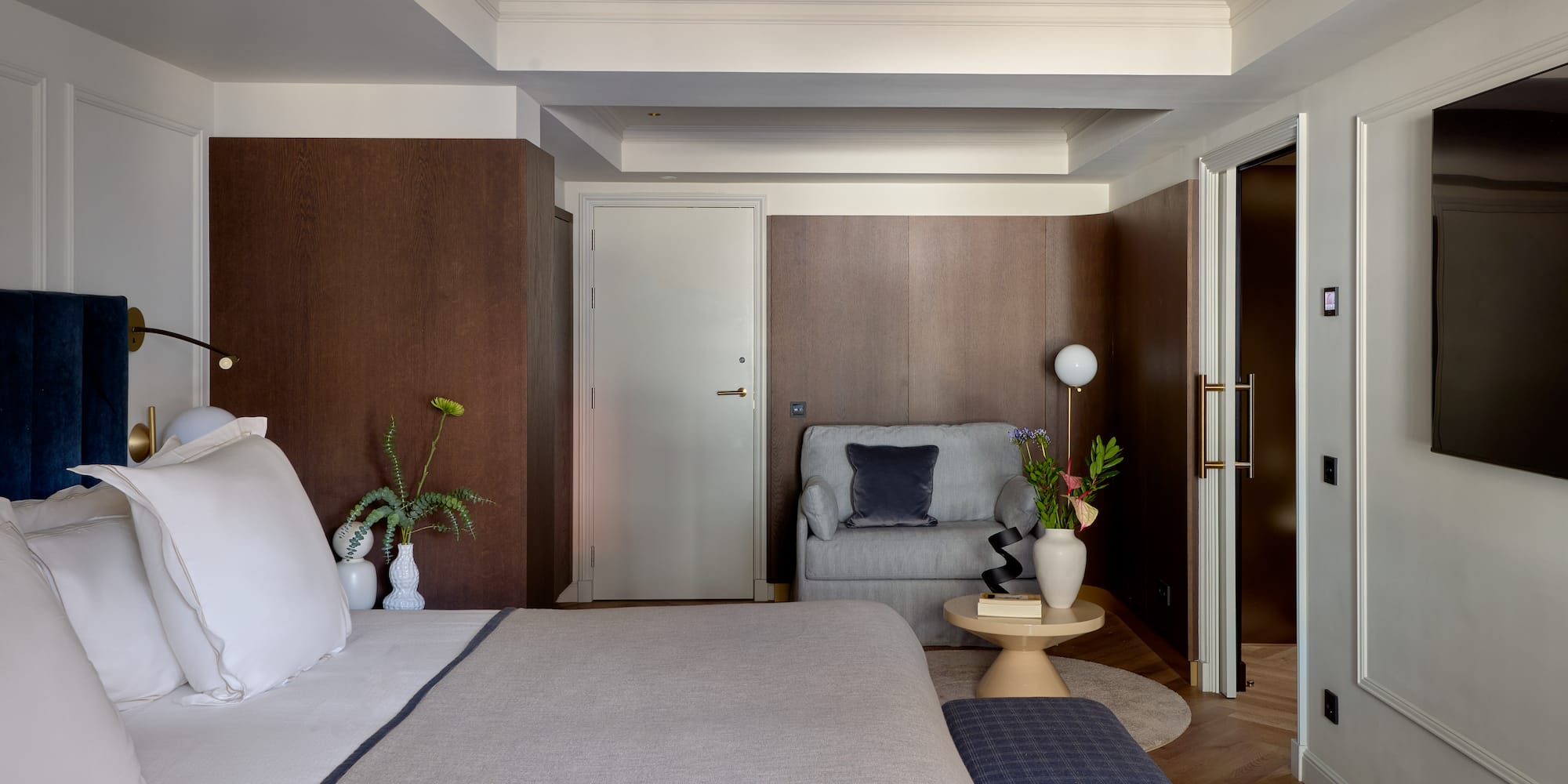 a bedroom with a bed and a couch