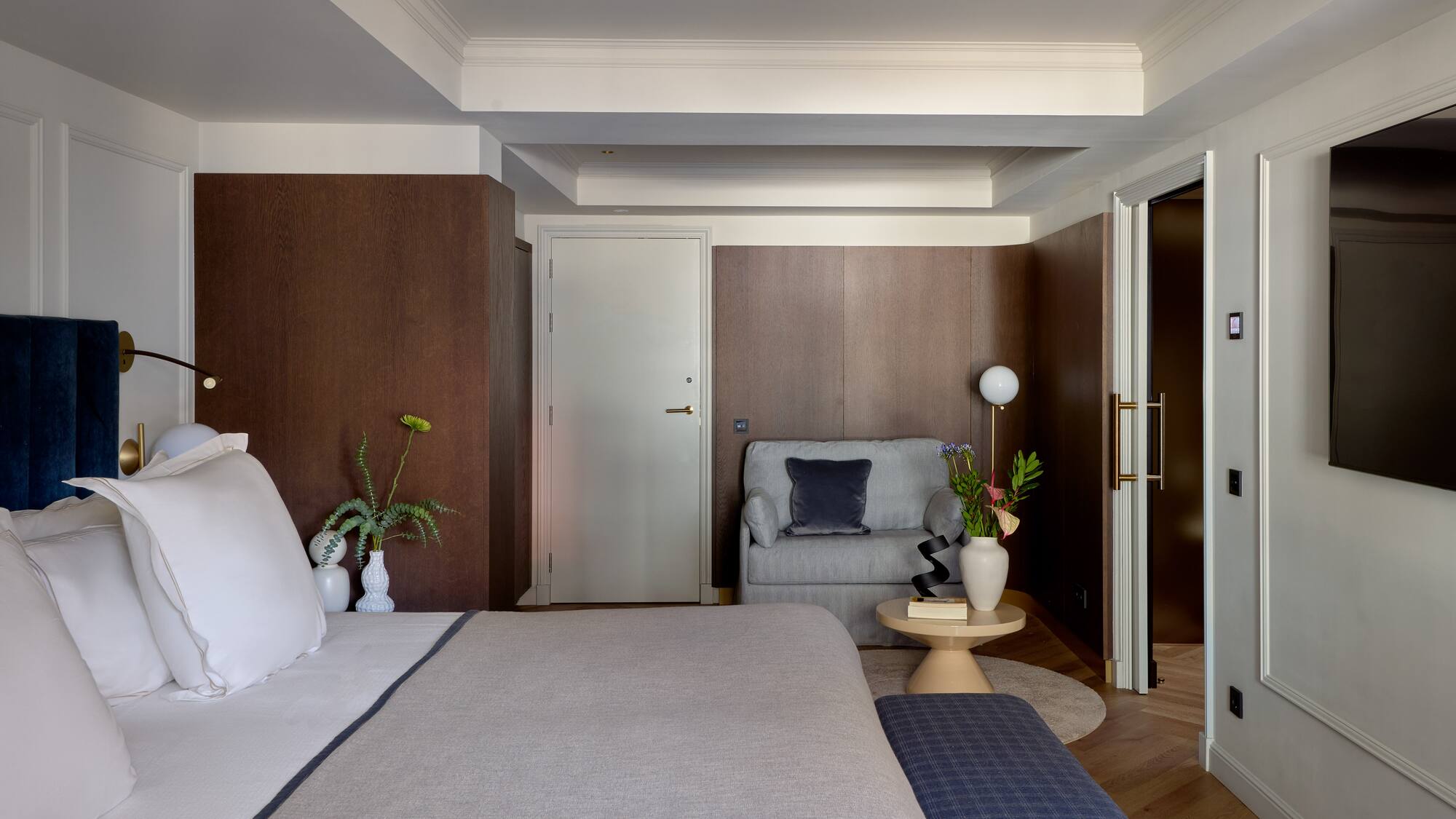 a bedroom with a bed and a couch