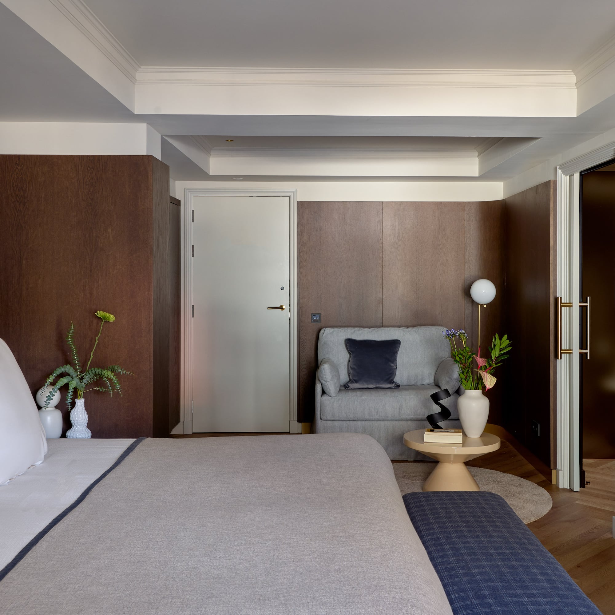 a bedroom with a bed and a couch