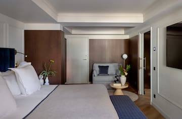 a bedroom with a bed and a couch