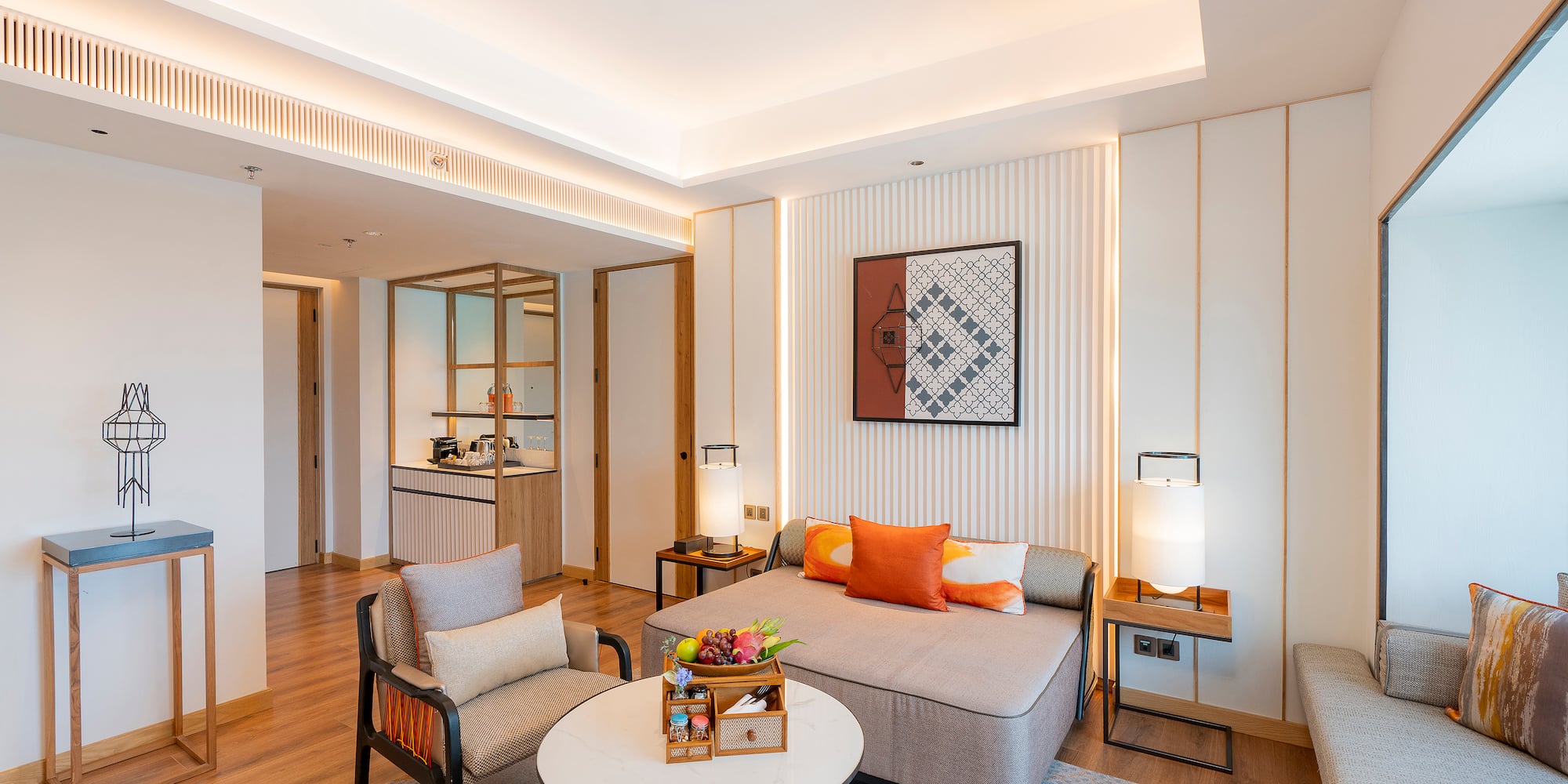 a room with a couch and chairs