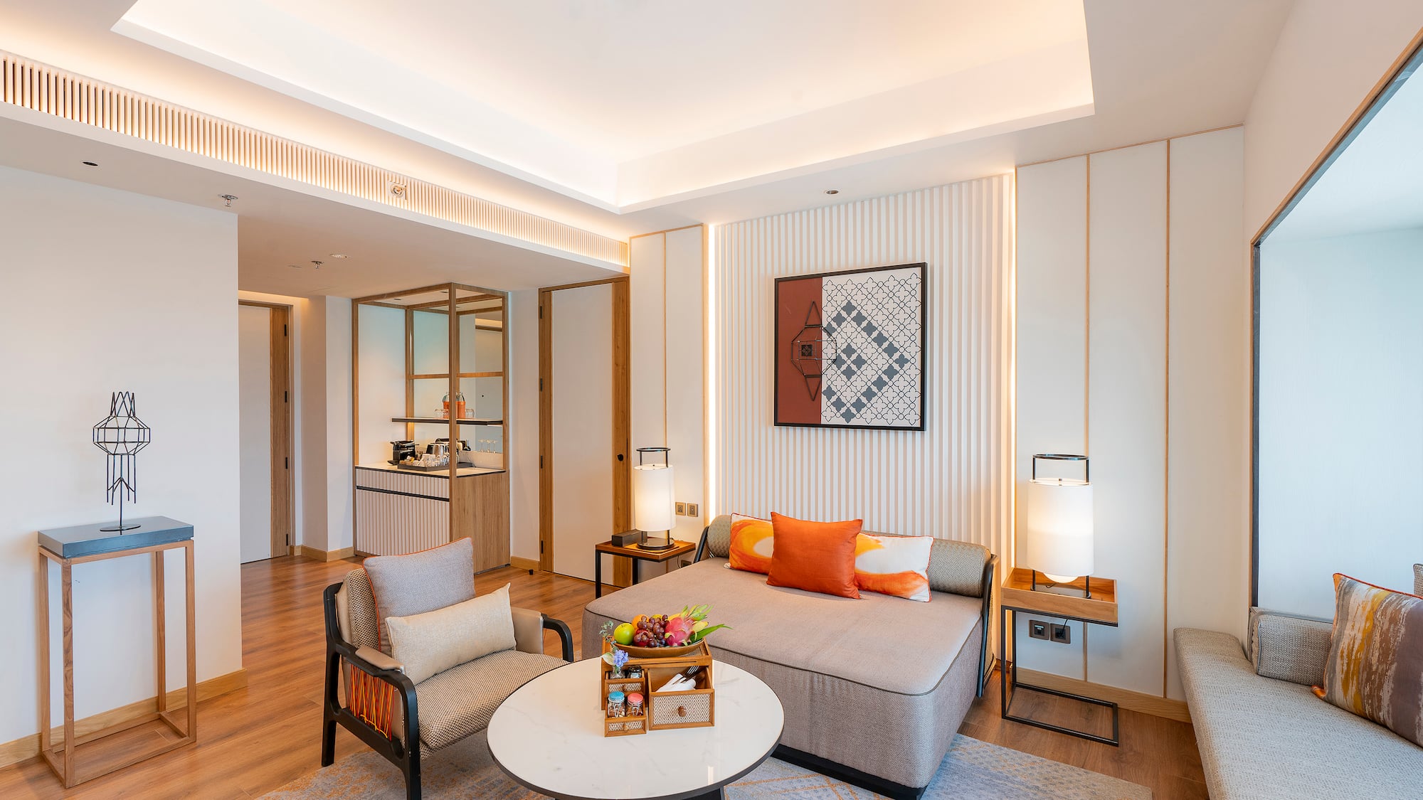 a room with a couch and chairs