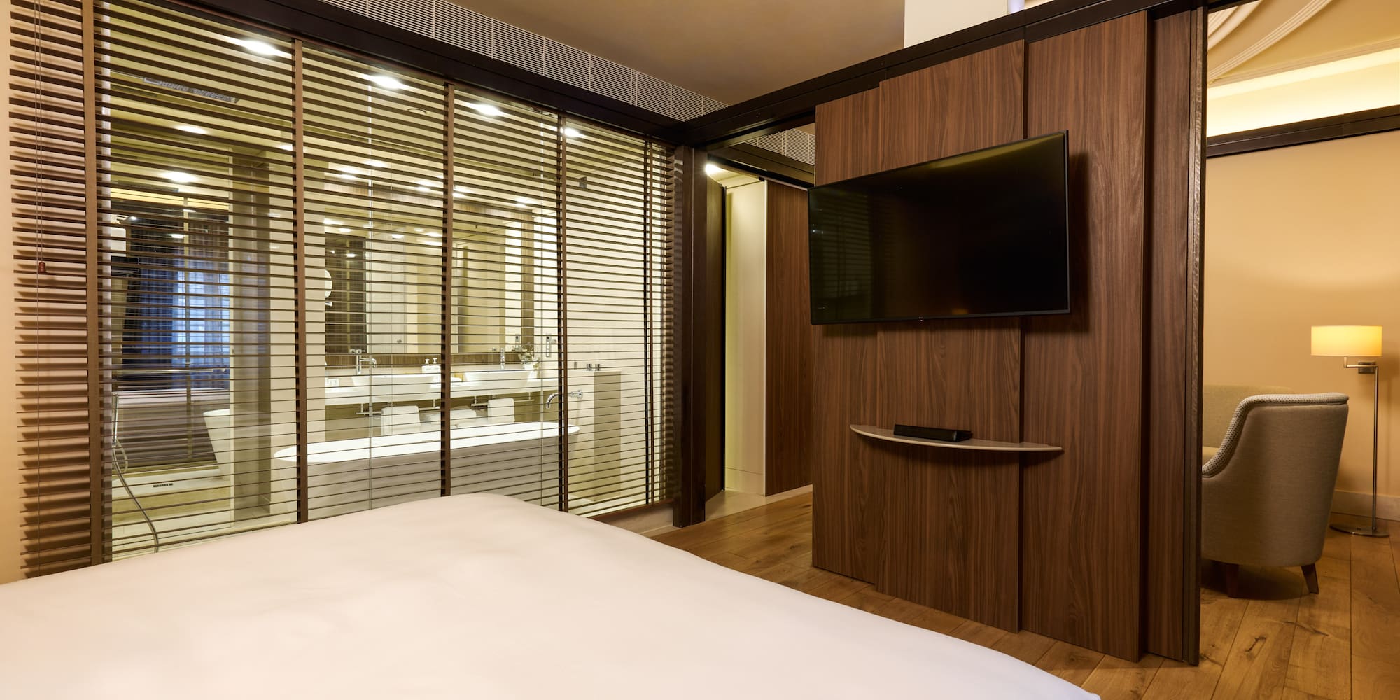 a room with a bed and a tv