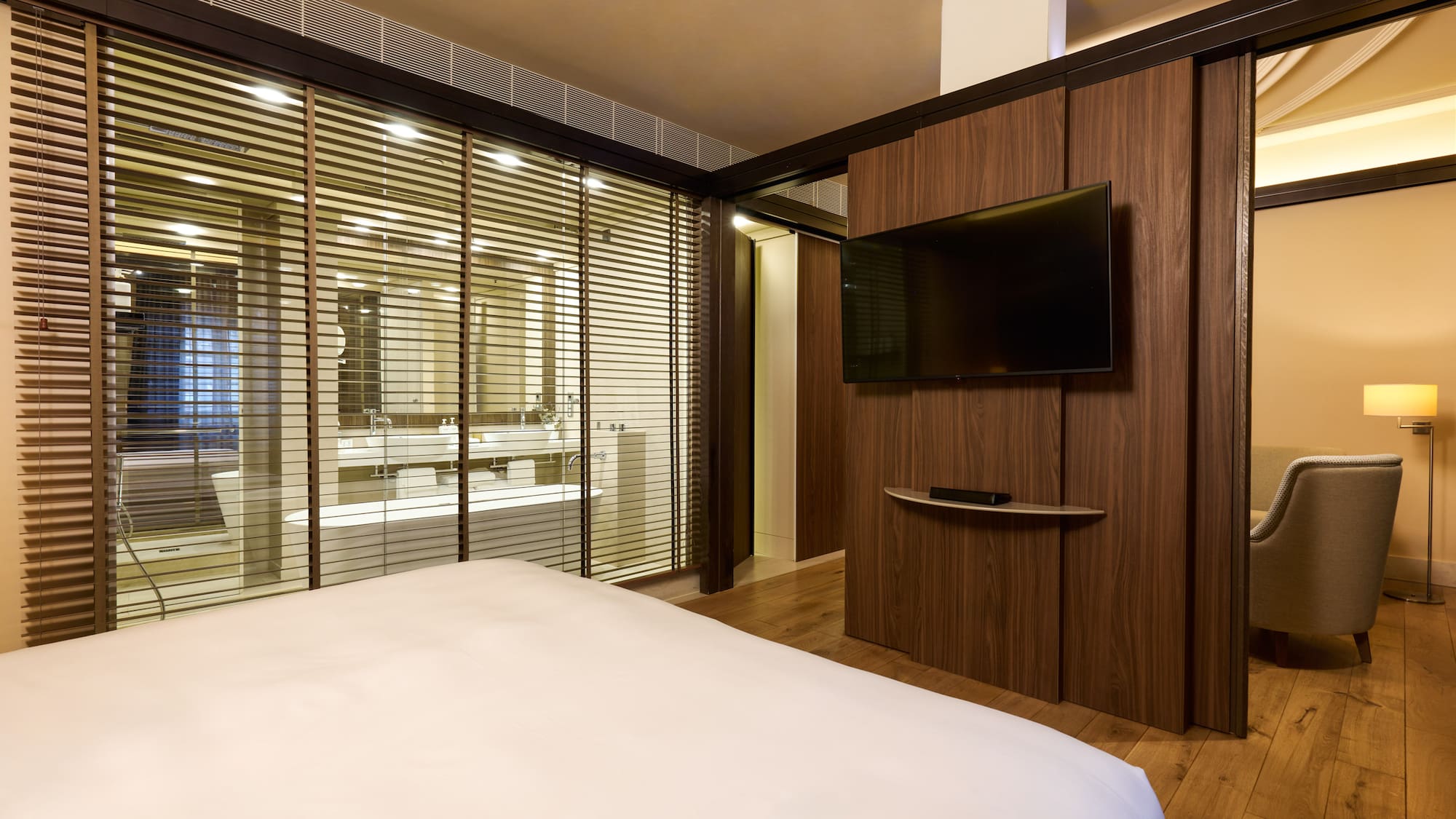 a room with a bed and a tv