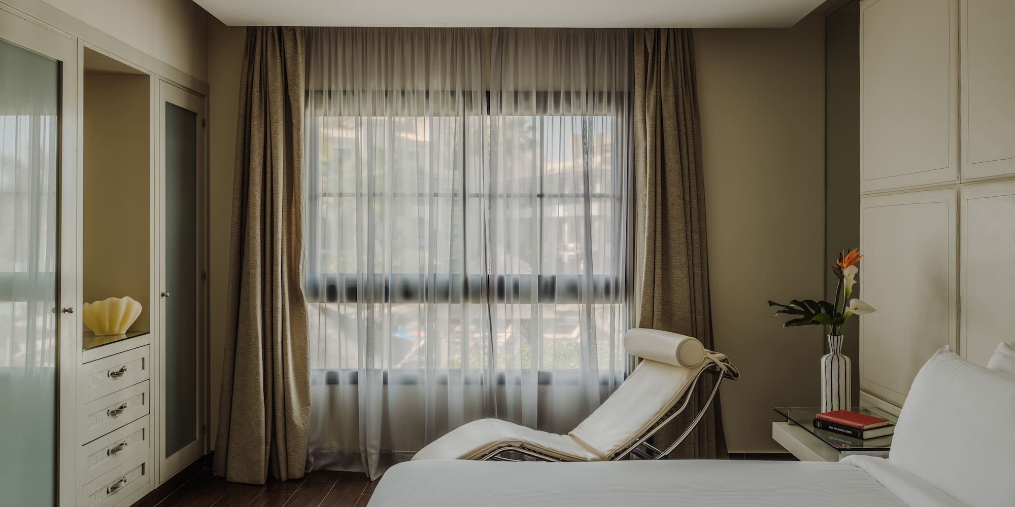 a bedroom with a bed and a window