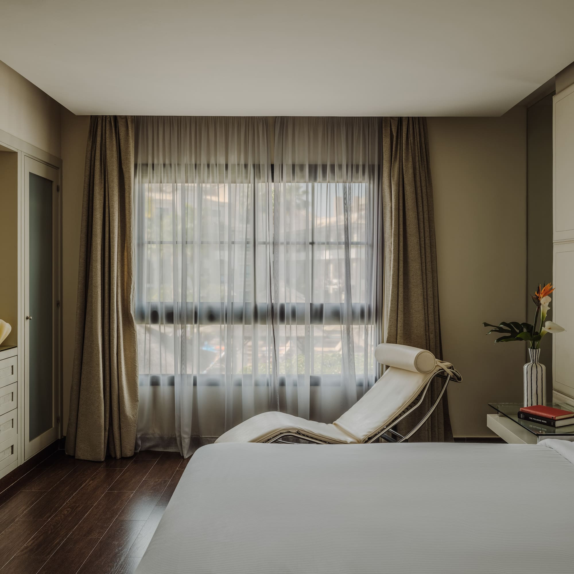 a bedroom with a bed and a window