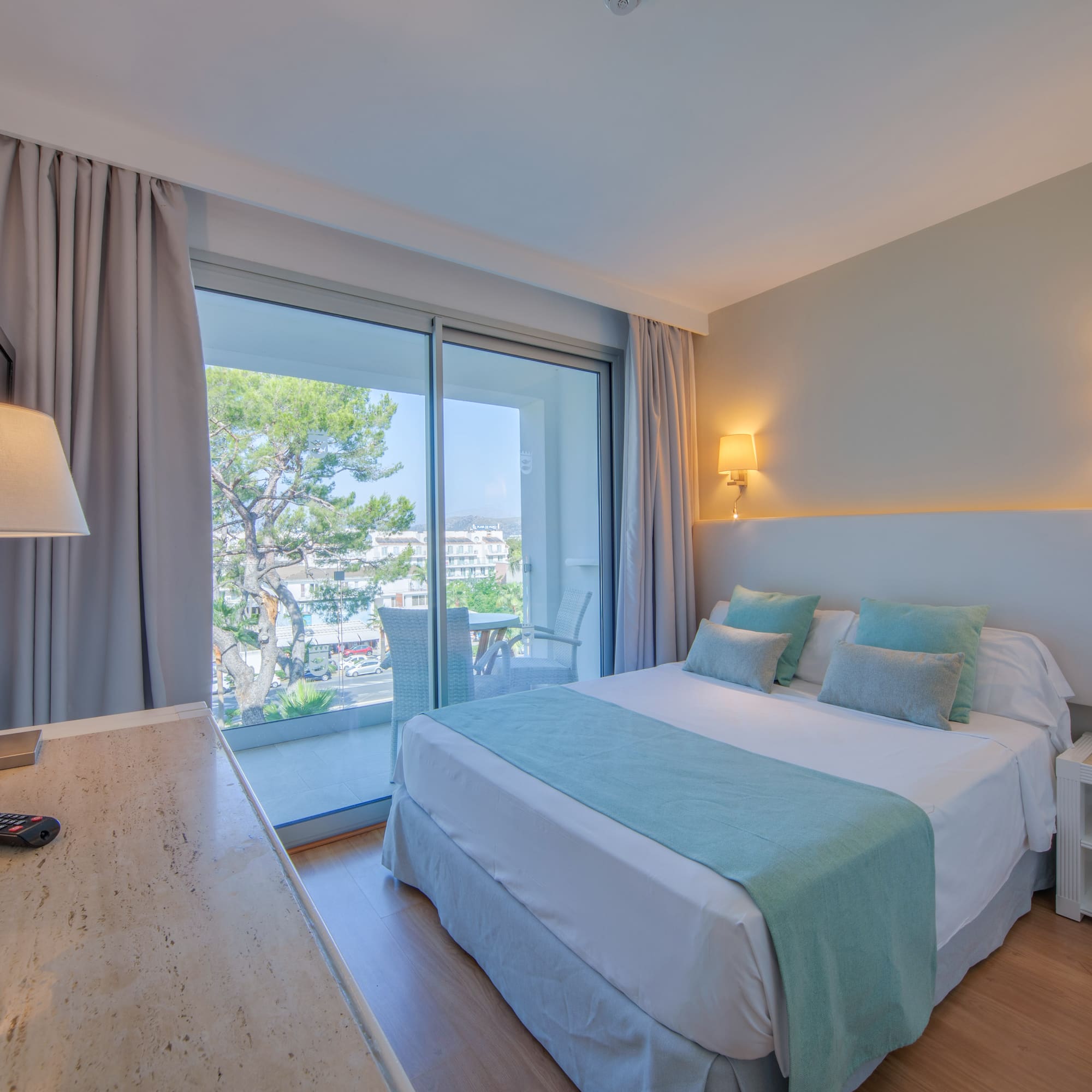 a bedroom with a desk and a bed