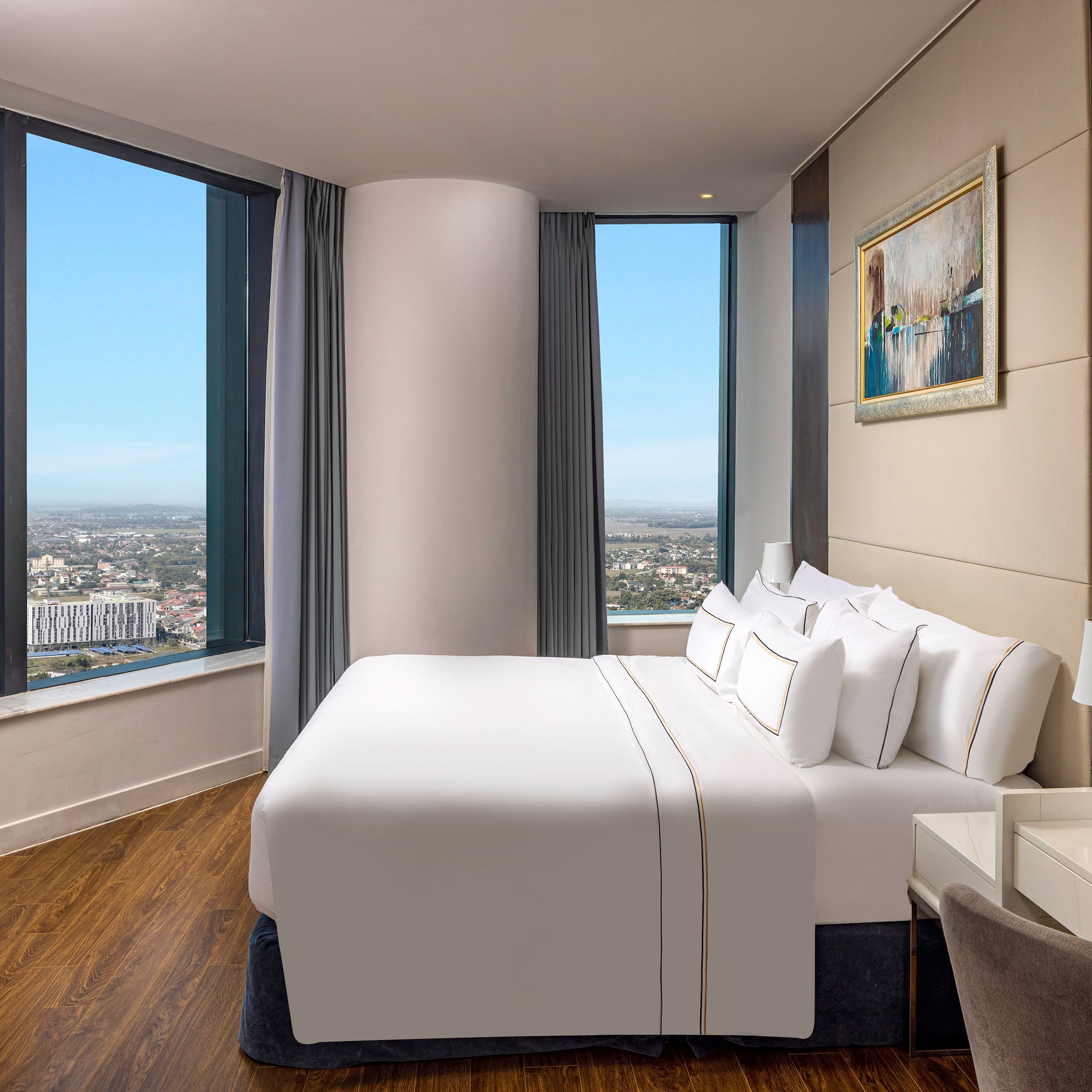 a bedroom with a large window and a large bed