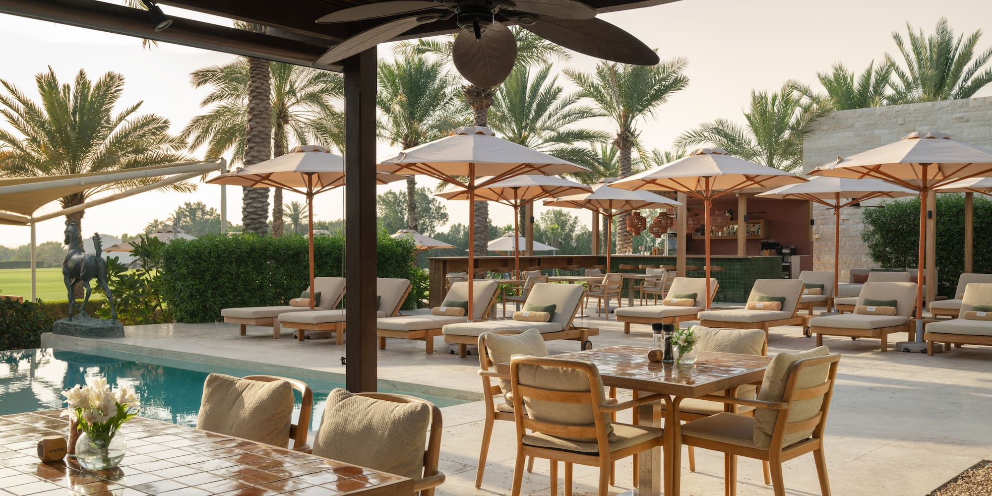 a pool with tables and chairs