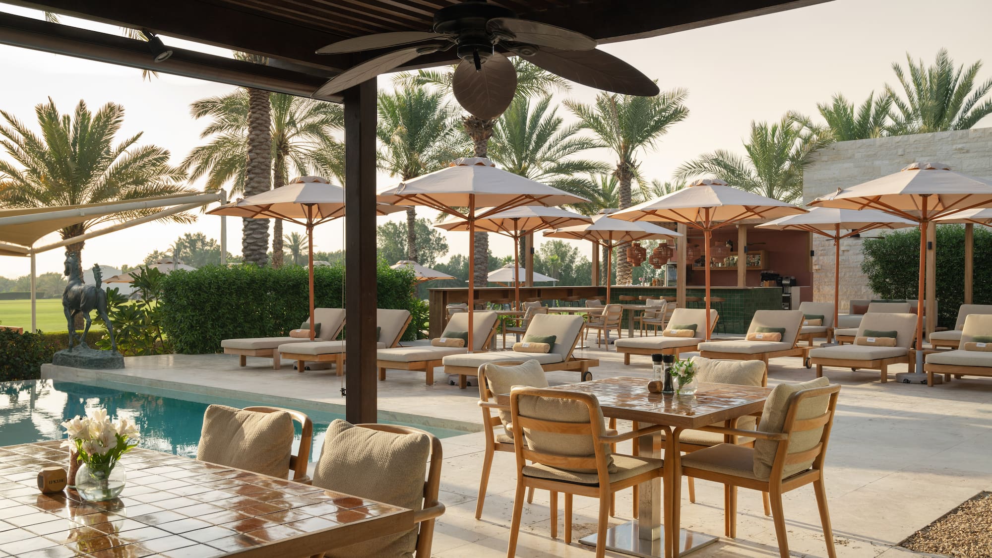 a pool with tables and chairs