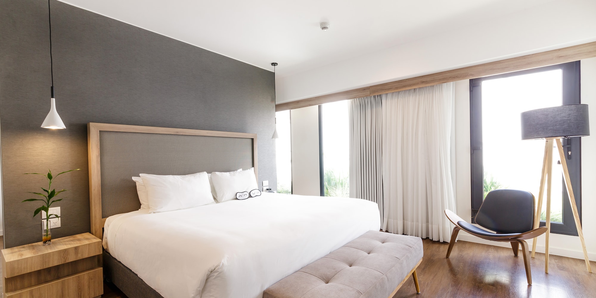 a bedroom with a bed and a chair