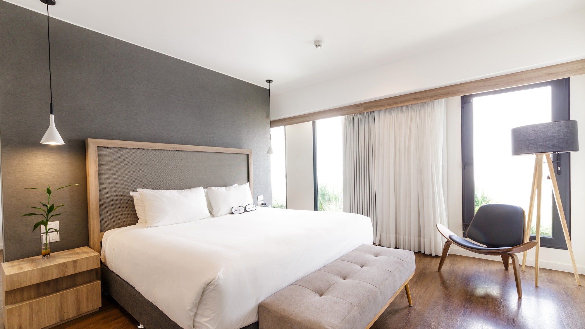 a bedroom with a bed and a chair