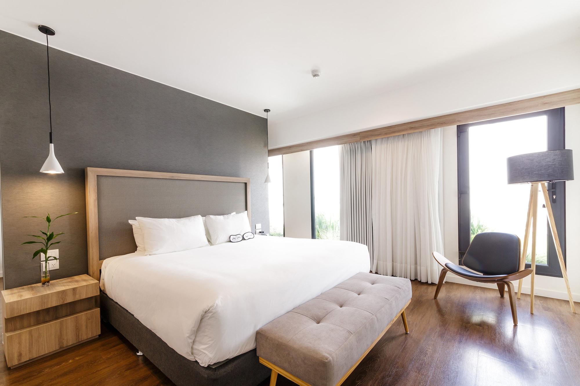 a bedroom with a bed and a chair