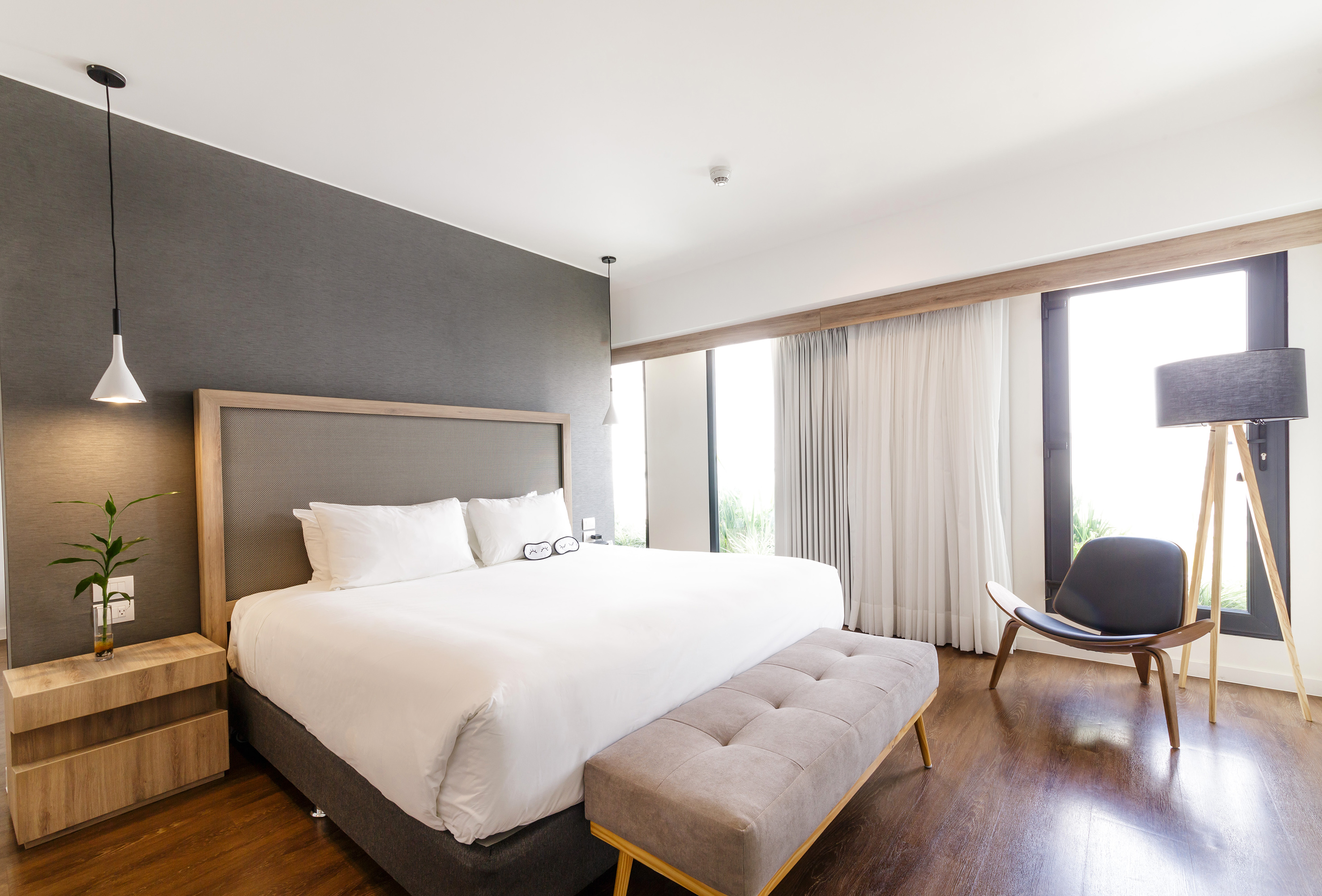 a bedroom with a bed and a chair