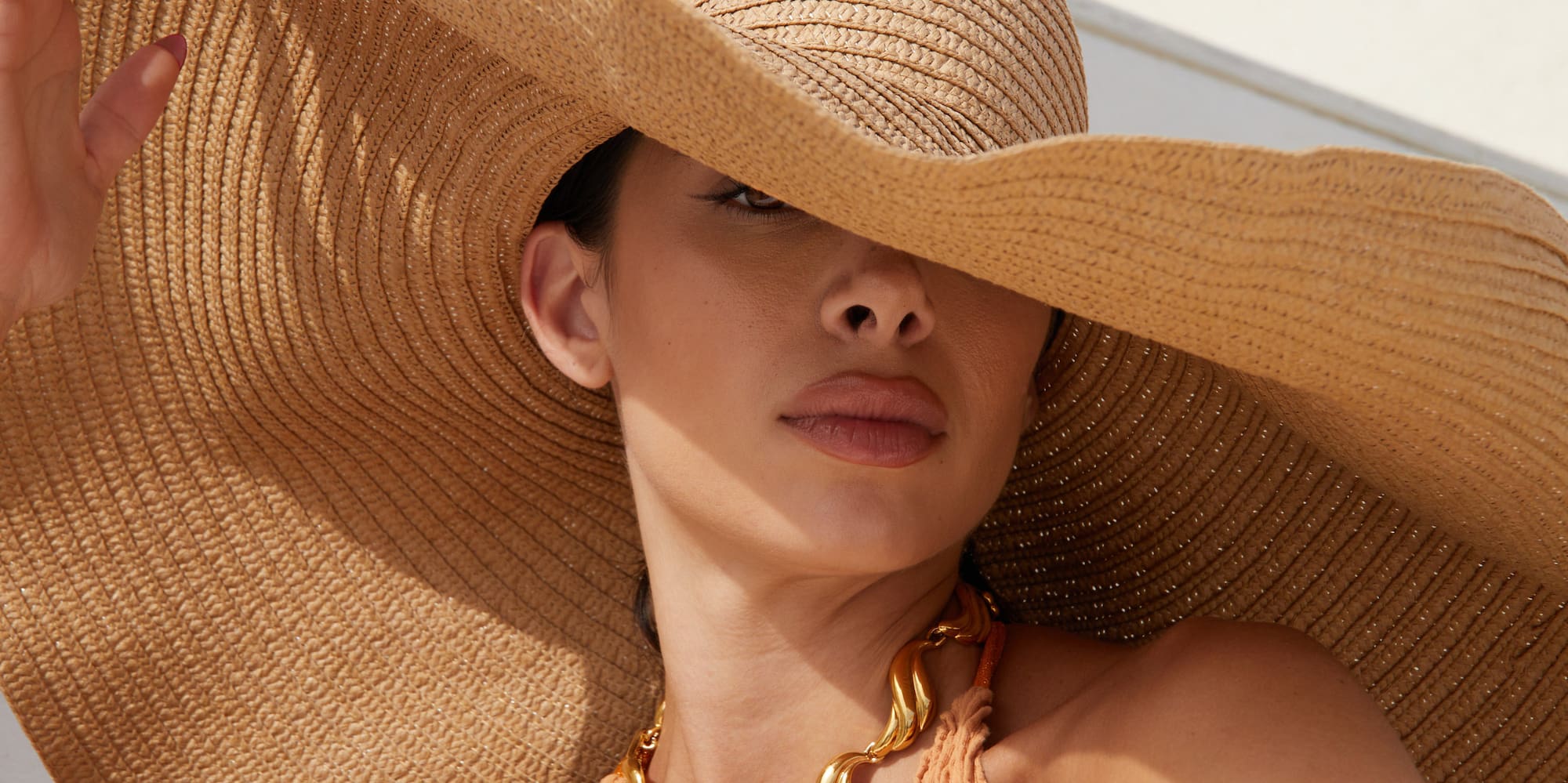 a woman wearing a hat and a garment