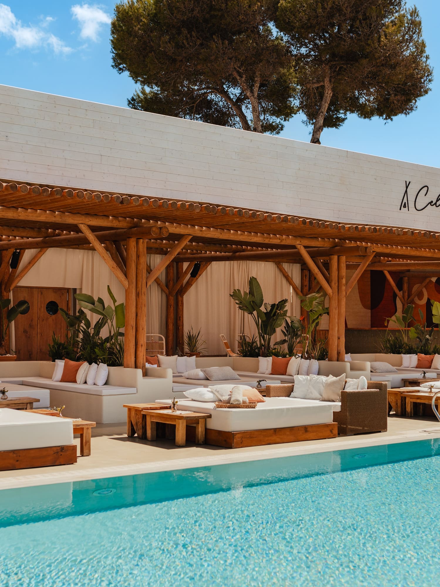 a pool with lounge chairs and a canopy over it