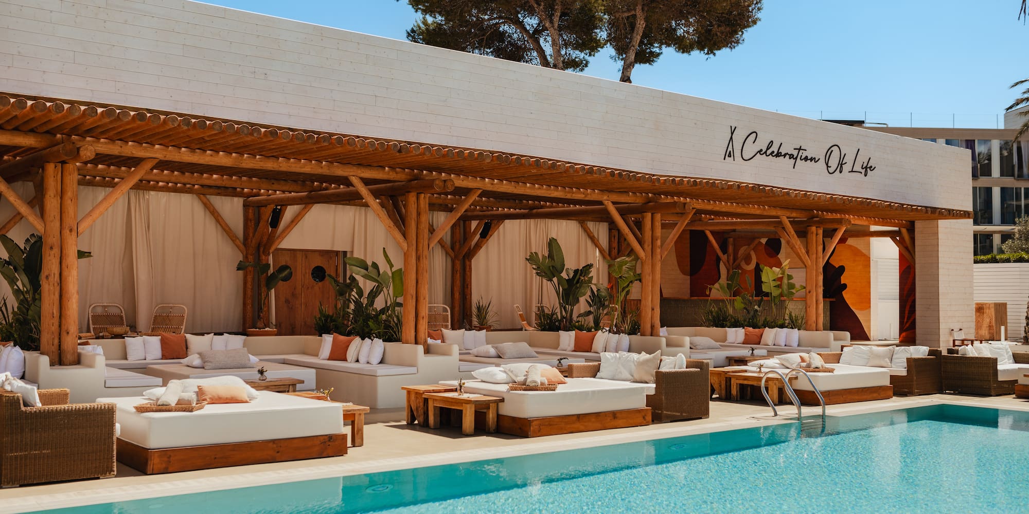 a pool with lounge chairs and a canopy over it