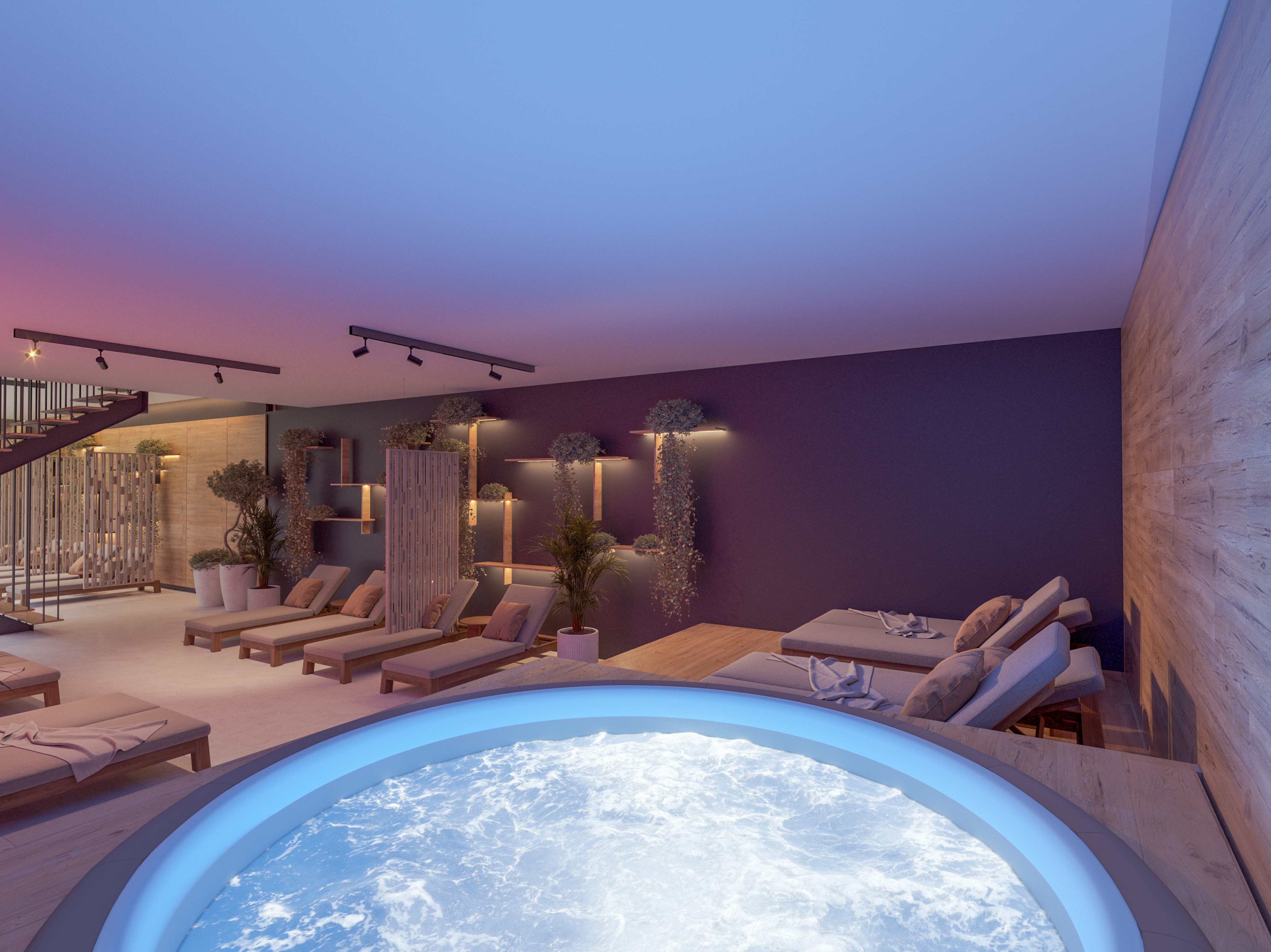 a room with a hot tub and lounge chairs