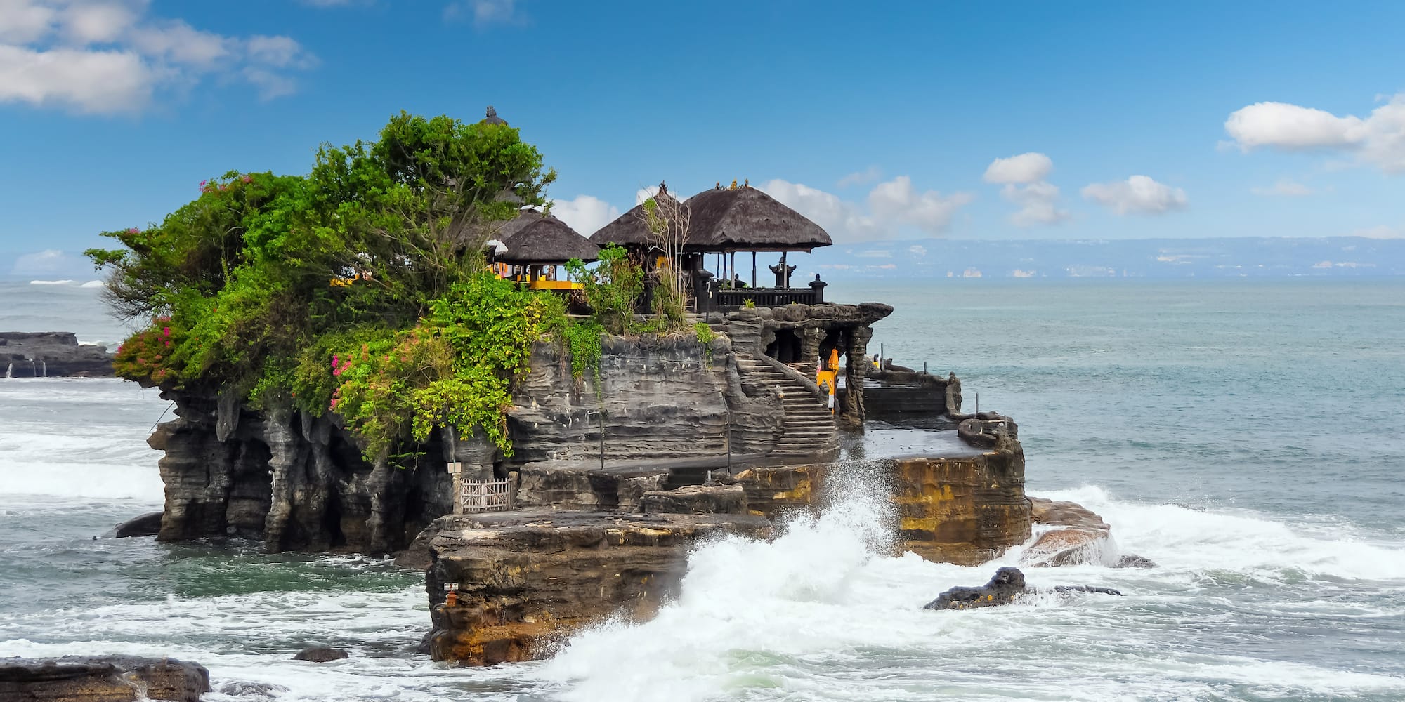 Tanah Lot on a rock with a large body of water