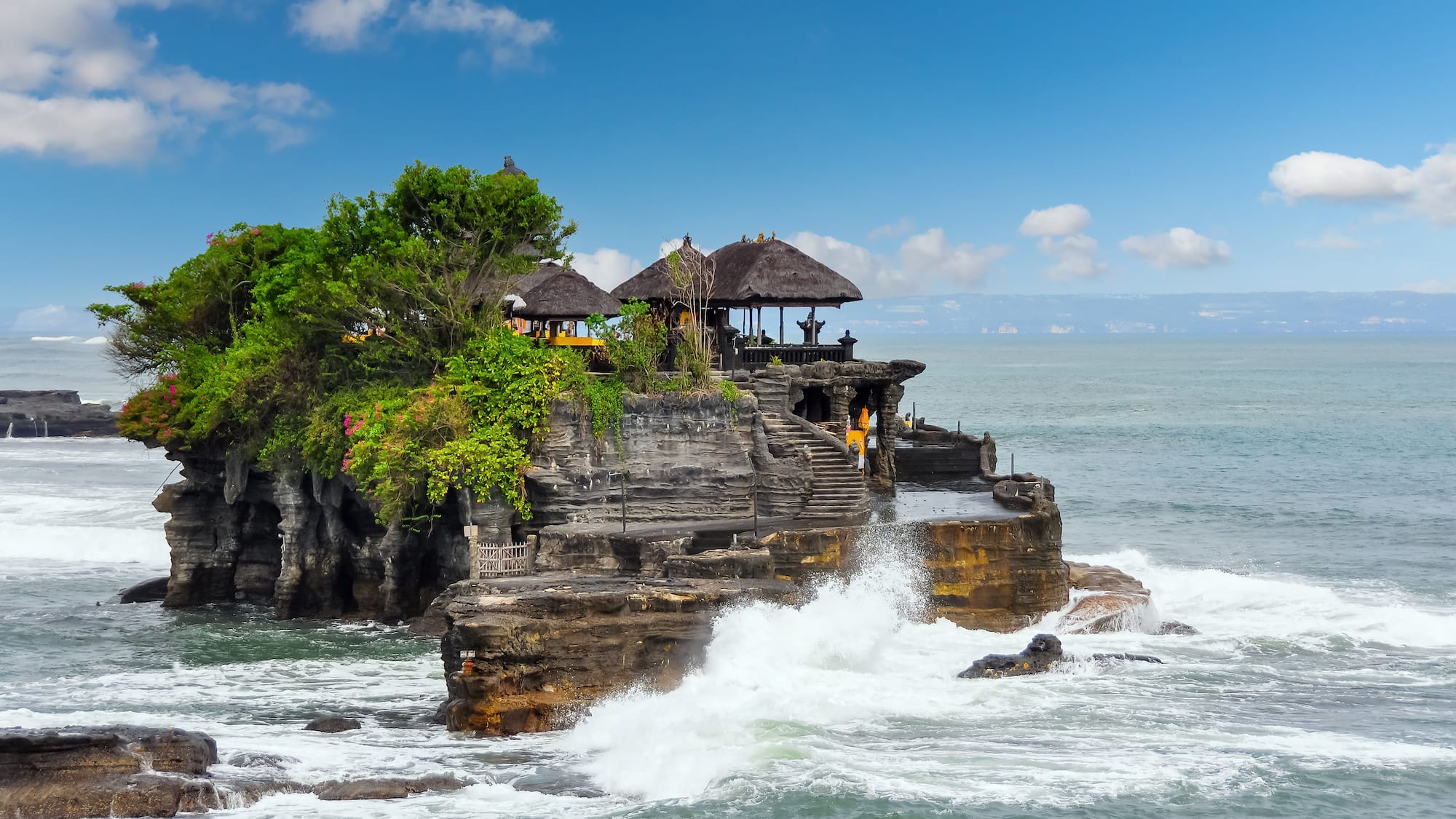Tanah Lot on a rock with a large body of water