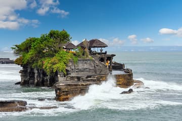 Tanah Lot on a rock with a large body of water