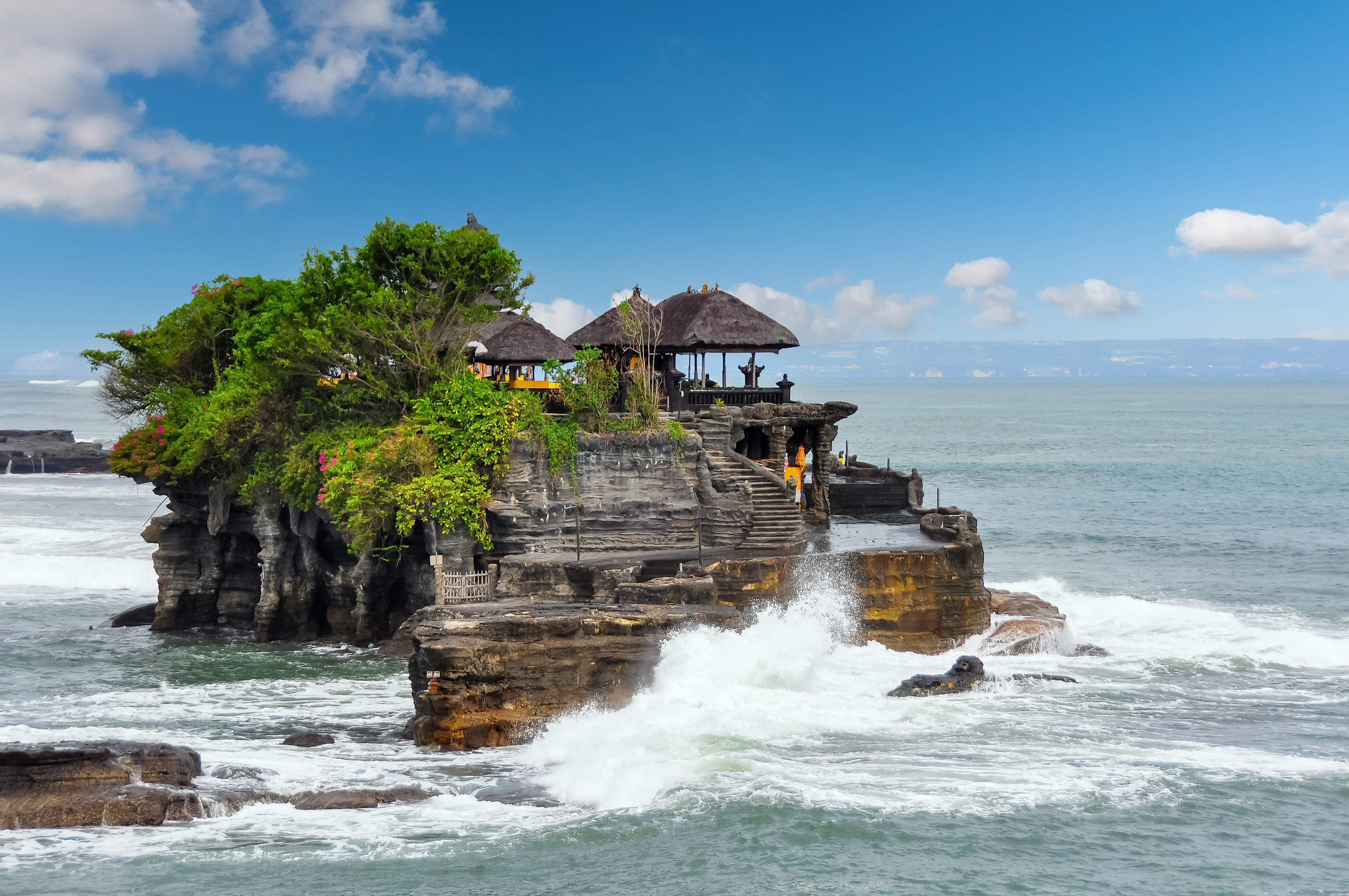 Tanah Lot on a rock with a large body of water
