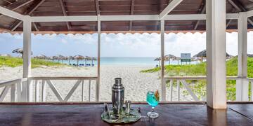 a bar with a drink on the table
