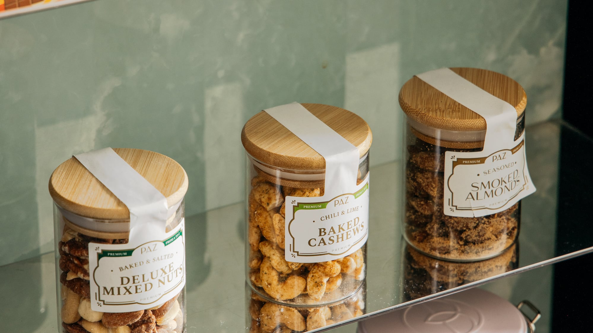 a glass shelf with jars of food