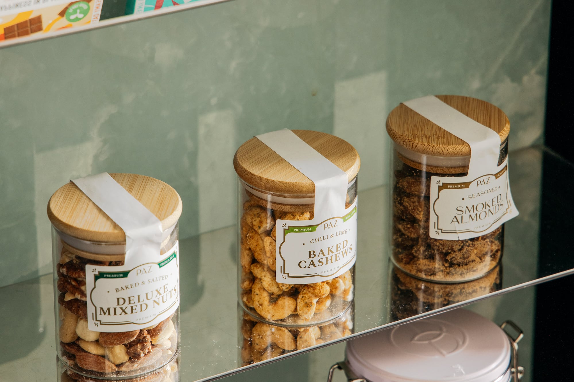 a glass shelf with jars of food