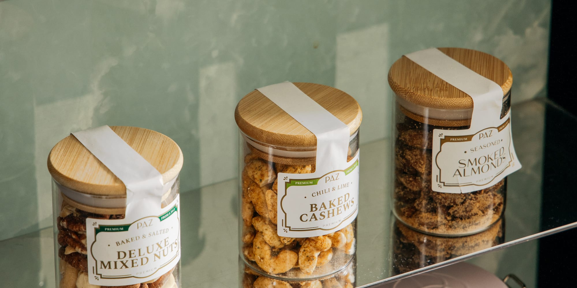a glass shelf with jars of food