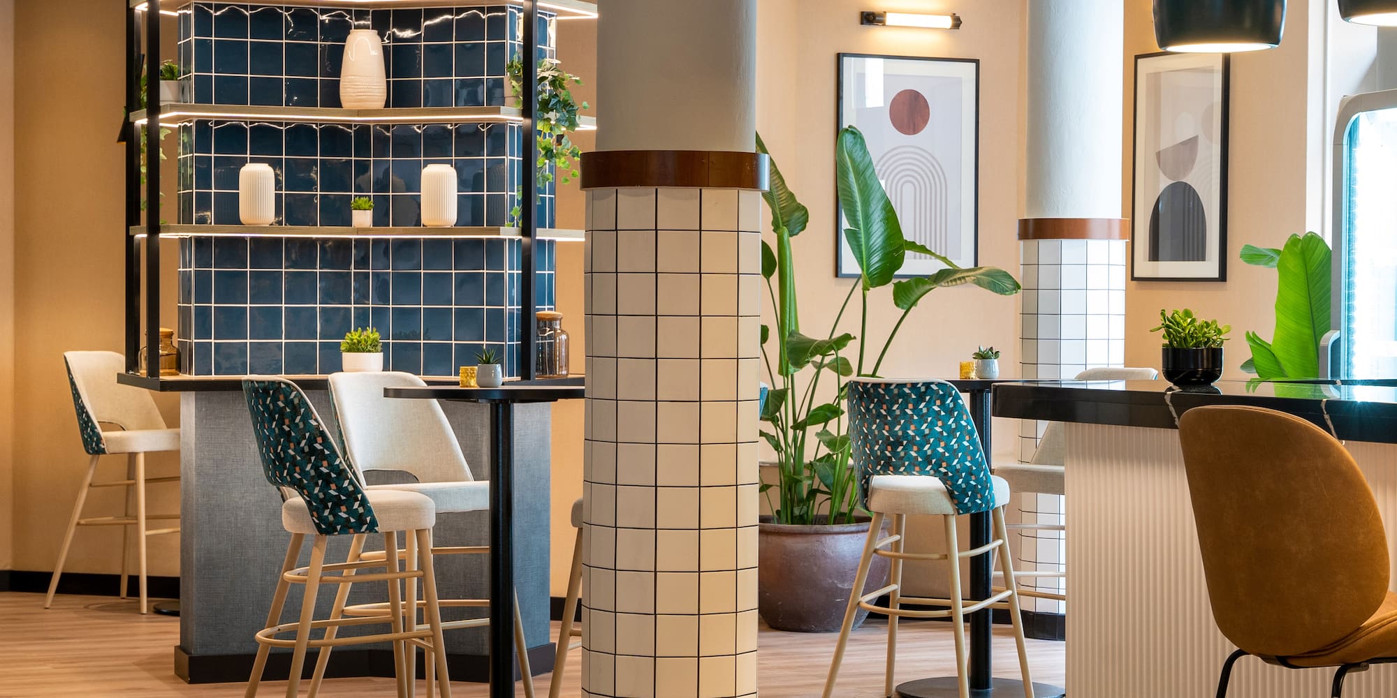 a room with a bar and chairs