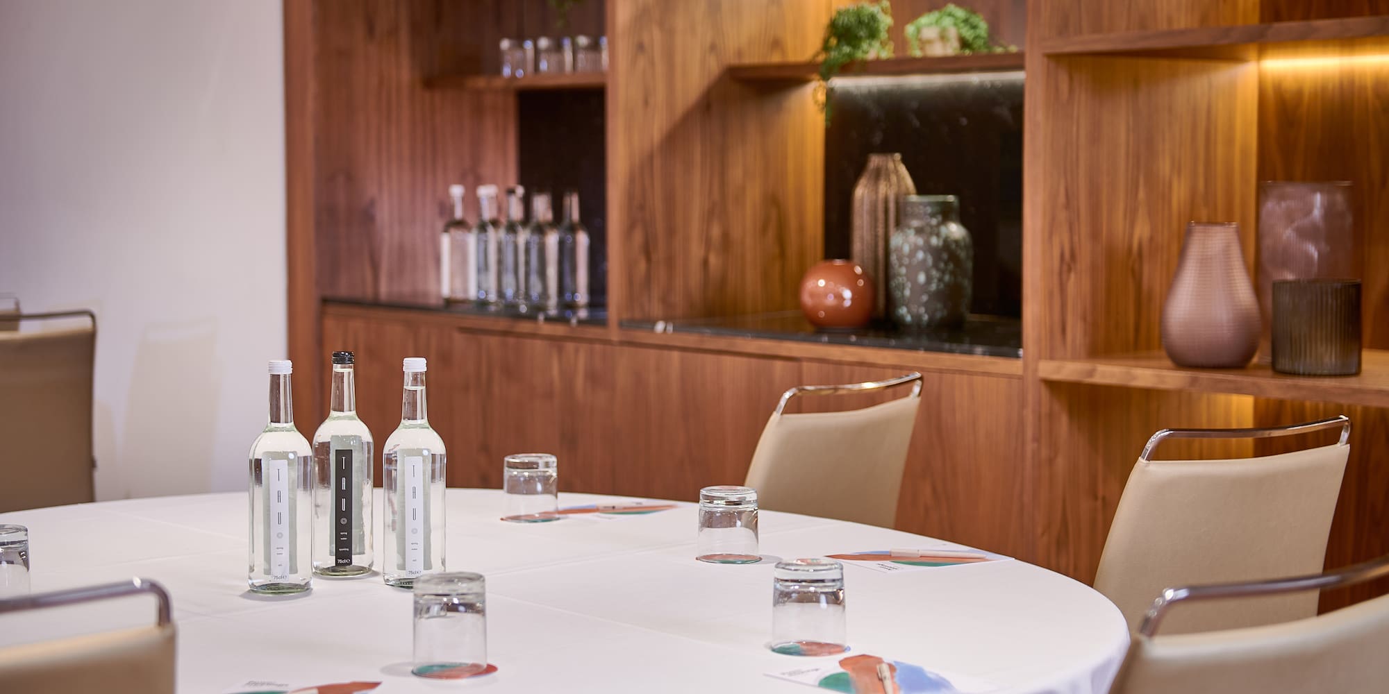 a table with white tablecloth and bottles on it